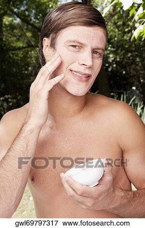 Man applying face pack View Large Photo Image Stock Photo - Man applying face pack. Fotosearch