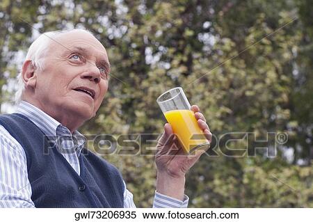 Man drinking juice View Large Photo Image Stock Photography - Man drinking juice. Fotosearch