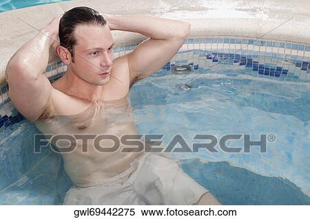 Man relaxing in a hot tub View Large Photo Image Stock Photography - Man relaxing in a hot tub. Fotosearch