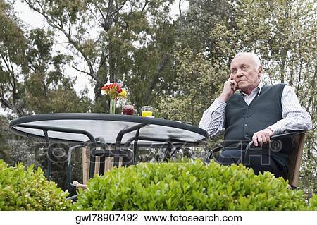 Man sitting in a garden and thinking View Large Photo Image Stock Image - Man sitting in a garden and thinking. Fotosearch