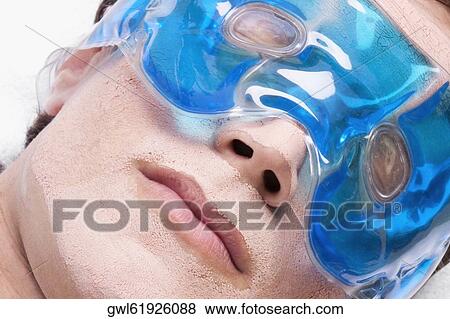 Stock Photo - Man wearing eye mask. Fotosearch