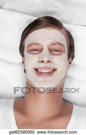 Man with face pack on his face View Large Photo Image Stock Image - Man with face pack on his face. Fotosearch