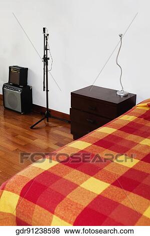 Musical instruments in the bedroom View Large Photo Image Stock Photo - Musical instruments in the bedroom. Fotosearch