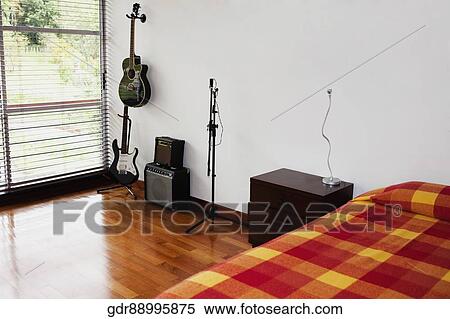 Musical instruments in the bedroom View Large Photo Image Stock Photography - Musical instruments in the bedroom. Fotosearch