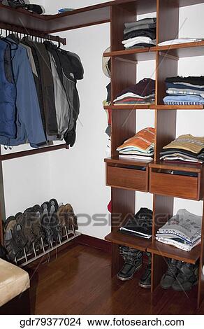 Neatly arranged clothes in drawers View Large Photo Image Picture - Neatly arranged clothes in drawers. Fotosearch