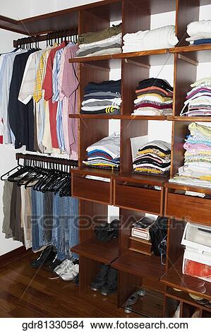 Neatly arranged clothes in drawers View Large Photo Image Picture - Neatly arranged clothes in drawers. Fotosearch