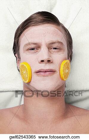 Orange slices on a man's face View Large Photo Image Stock Photography - Orange slices on a man's face. Fotosearch