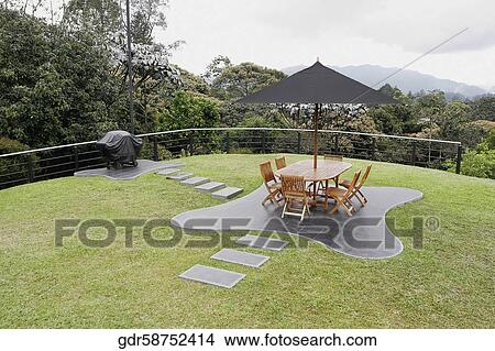 Picture - Outdoor furniture in a lawn. Fotosearch