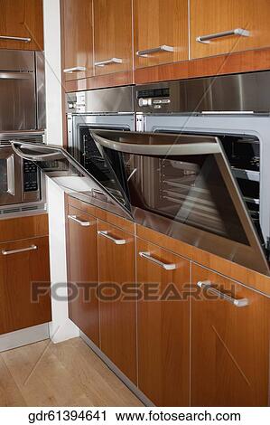 Ovens in the kitchen View Large Photo Image Stock Image - Ovens in the kitchen. Fotosearch
