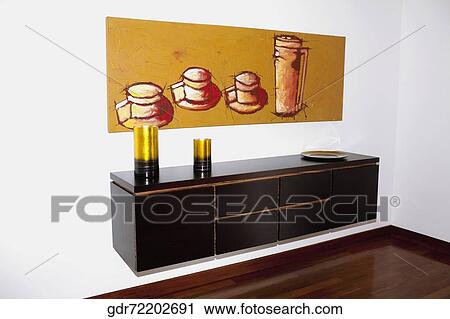 Painting and a dresser in a room View Large Photo Image Stock Image - Painting and a dresser in a room. Fotosearch