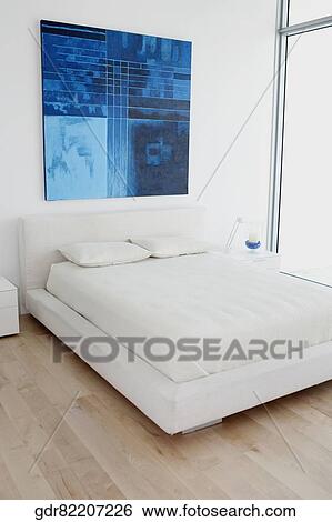 Paintings with a bed in the bedroom View Large Photo Image Stock Photograph - Paintings with a bed in the bedroom. Fotosearch