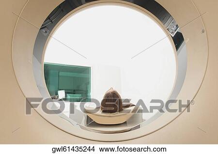 Patient going through an MRI scan View Large Photo Image Picture - Patient going through an MRI scan. Fotosearch