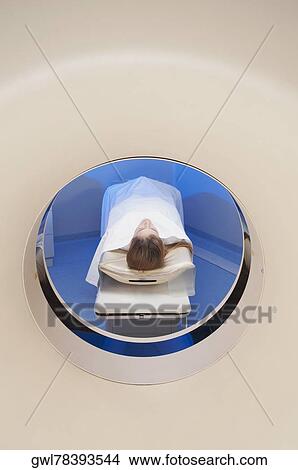 Picture - Patient going through an MRI scan. Fotosearch