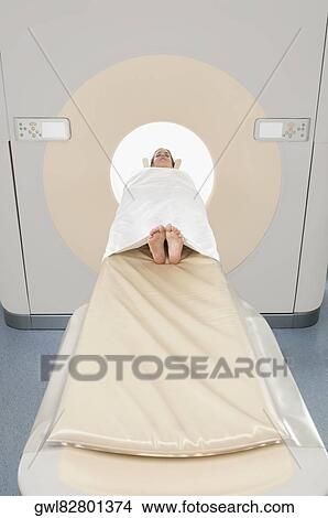 Patient going through an MRI scan View Large Photo Image Picture - Patient going through an MRI scan. Fotosearch