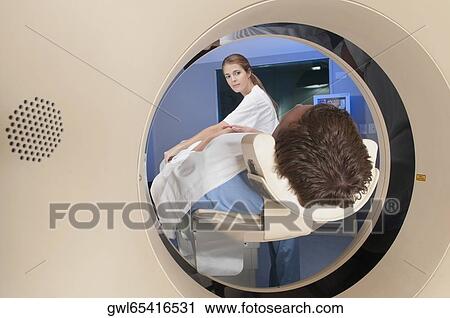 Patient going through an MRI scan View Large Photo Image Stock Image - Patient going through an MRI scan. Fotosearch