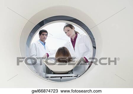 Stock Image - Patient going through an MRI scan. Fotosearch