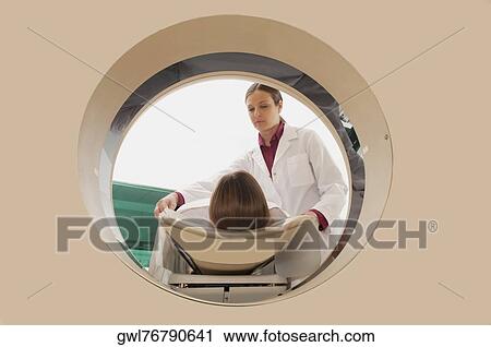 Patient going through an MRI scan View Large Photo Image Stock Image - Patient going through an MRI scan. Fotosearch