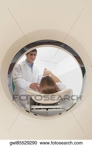 Patient going through an MRI scan View Large Photo Image Stock Image - Patient going through an MRI scan. Fotosearch