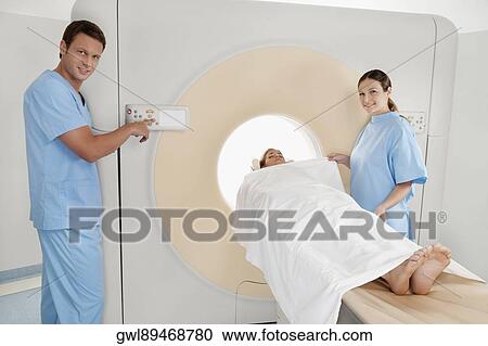 Patient going through an MRI scan View Large Photo Image Stock Image - Patient going through an MRI scan. Fotosearch