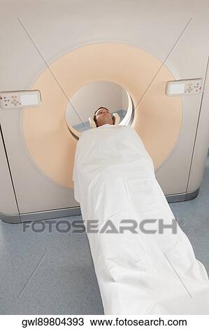 Patient going through an MRI scan View Large Photo Image Stock Image - Patient going through an MRI scan. Fotosearch