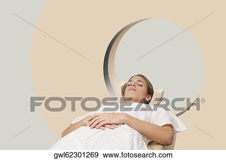 Patient going through an MRI scan View Large Photo Image Stock Photo - Patient going through an MRI scan. Fotosearch