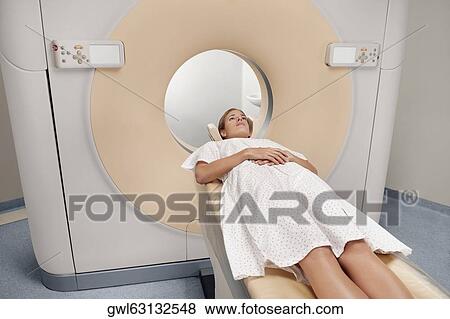 Patient going through an MRI scan View Large Photo Image Stock Photo - Patient going through an MRI scan. Fotosearch