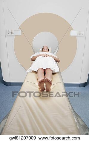 Patient going through an MRI scan View Large Photo Image Stock Photo - Patient going through an MRI scan. Fotosearch