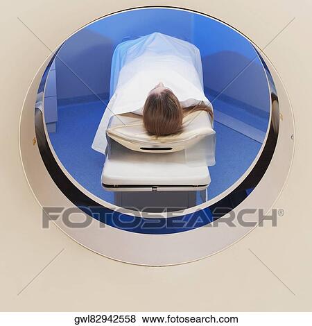 Patient going through an MRI scan View Large Photo Image Stock Photo - Patient going through an MRI scan. Fotosearch