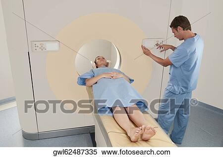 Patient going through an MRI scan View Large Photo Image Stock Photography - Patient going through an MRI scan. Fotosearch