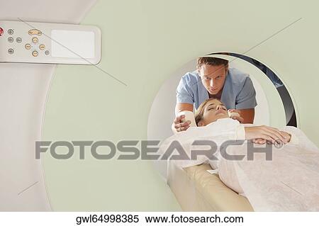 Stock Photography - Patient going through an MRI scan. Fotosearch