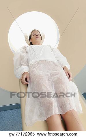 Patient going through an MRI scan View Large Photo Image Stock Photography - Patient going through an MRI scan. Fotosearch