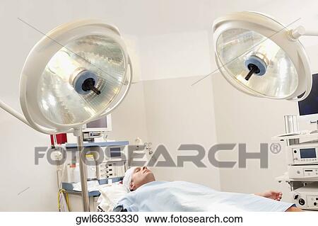 Patient lying on an operation table View Large Photo Image Stock Image - Patient lying on an operation table. Fotosearch