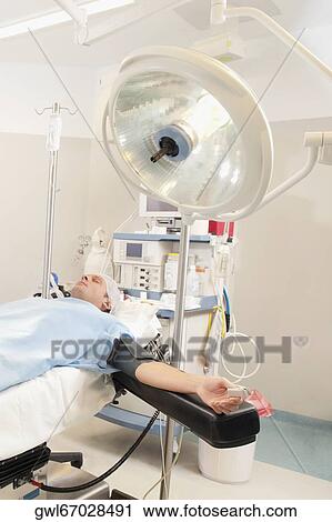 Patient lying on an operation table View Large Photo Image Stock Image - Patient lying on an operation table. Fotosearch