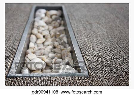 Pebbles on a table View Large Photo Image Stock Photo - Pebbles on a table. Fotosearch