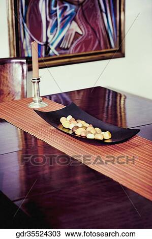 Pebbles on a tray on a table View Large Photo Image Stock Image - Pebbles on a tray on a table. Fotosearch