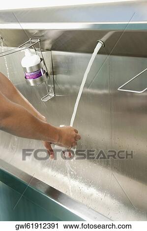Person washing hands View Large Photo Image Stock Image - Person washing hands. Fotosearch