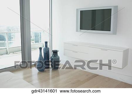Plasma television in a bedroom View Large Photo Image Stock Image - Plasma television in a bedroom. Fotosearch
