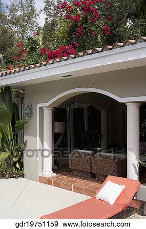 Stock Photo - Porch of a house with furniture. Fotosearch