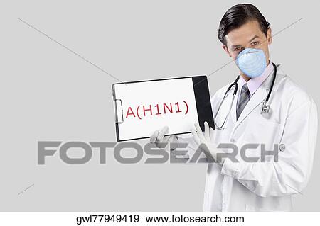 Portrait of a doctor showing H1N1 sign View Large Photo Image Stock Photo - Portrait of a doctor showing H1N1 sign. Fotosearch