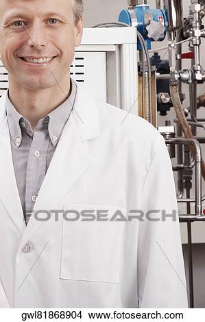 Portrait of a doctor smiling in a laboratory View Large Photo Image Picture - Portrait of a doctor smiling in a laboratory. Fotosearch