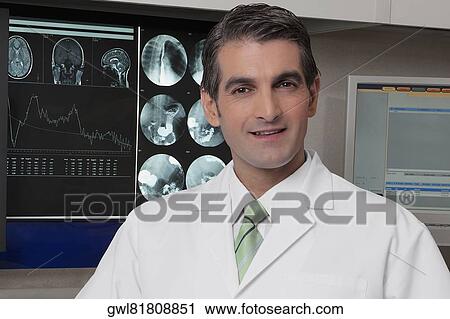 Portrait of a doctor smiling View Large Photo Image Stock Image - Portrait of a doctor smiling. Fotosearch