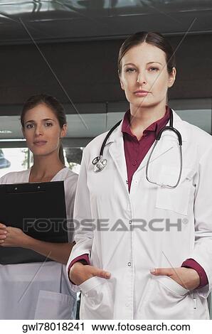 Portrait of a female doctor and a nurse View Large Photo Image Stock Image - Portrait of a female doctor and a nurse. Fotosearch