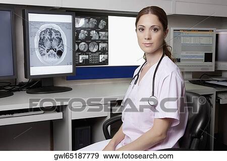 Portrait of a female doctor with MRI report View Large Photo Image Stock Photo - Portrait of a female doctor with MRI report. Fotosearch