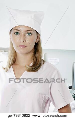 Portrait of a female nurse standing View Large Photo Image Stock Image - Portrait of a female nurse standing. Fotosearch