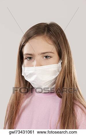 Portrait of a girl wearing a flu mask View Large Photo Image Stock Image - Portrait of a girl wearing a flu mask. Fotosearch