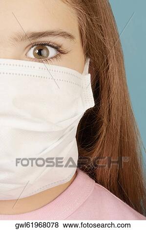 Portrait of a girl wearing a flu mask View Large Photo Image Stock Photo - Portrait of a girl wearing a flu mask. Fotosearch