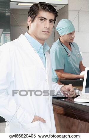 Portrait of a male doctor View Large Photo Image Stock Photography - Portrait of a male doctor. Fotosearch