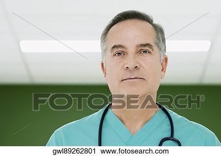 Portrait of a surgeon smiling View Large Photo Image Stock Image - Portrait of a surgeon smiling. Fotosearch