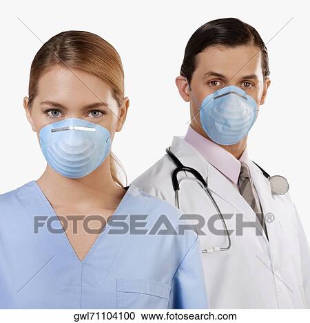 Portrait of doctors wearing flu masks View Large Photo Image Stock Image - Portrait of doctors wearing flu masks. Fotosearch