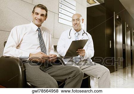 Stock Photo - Portrait of two doctors smiling. Fotosearch